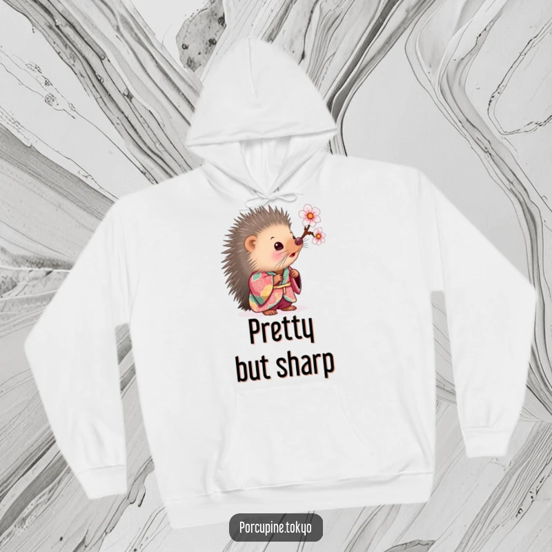 Funny Hoodie: A porcupine in a colorful kimono looking curiously at a cherry blossom, offering funny warmth and charm.